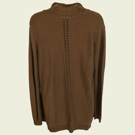 Brown sweater with intricate back design on a beige background