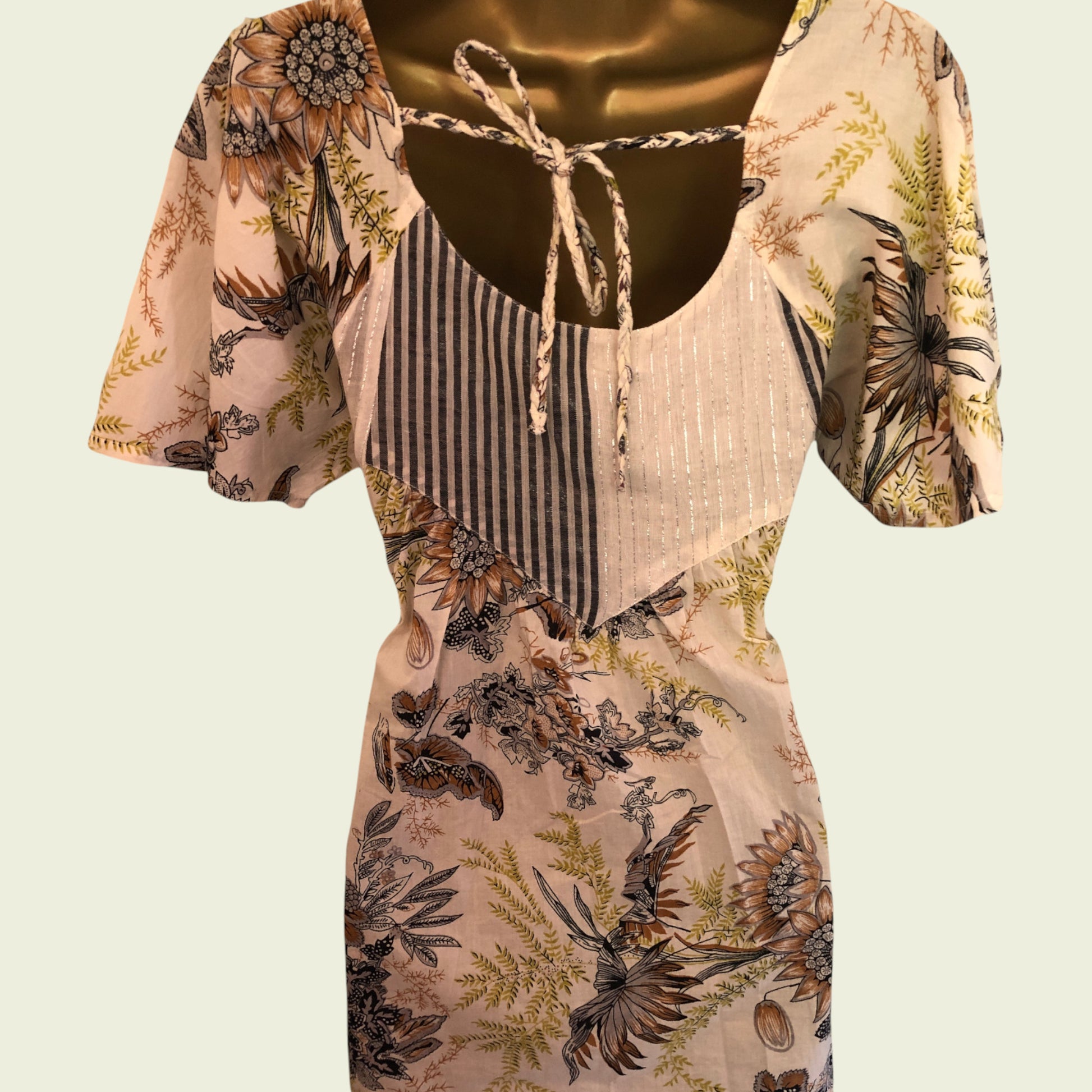 Floral patterned top with a plain background