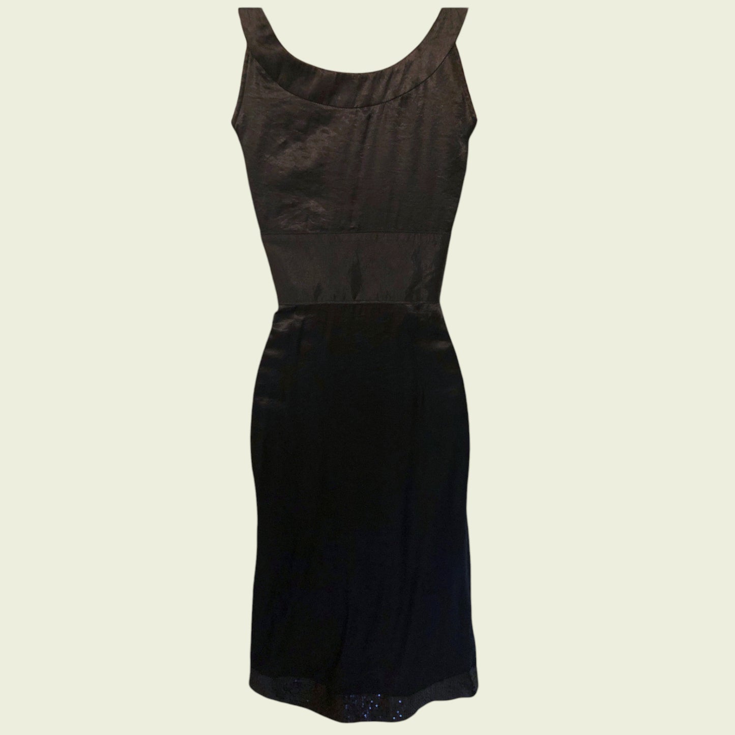 Black dress on a beige background