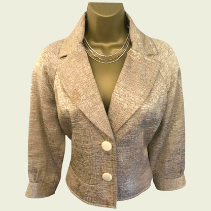 Beige blazer on a mannequin against a plain background