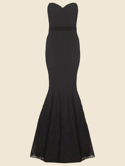 Black evening gown on a beige background