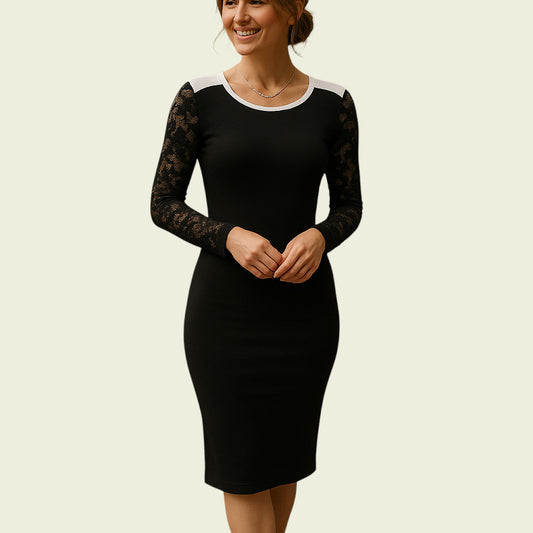 Woman wearing a black dress with lace sleeves on a beige background