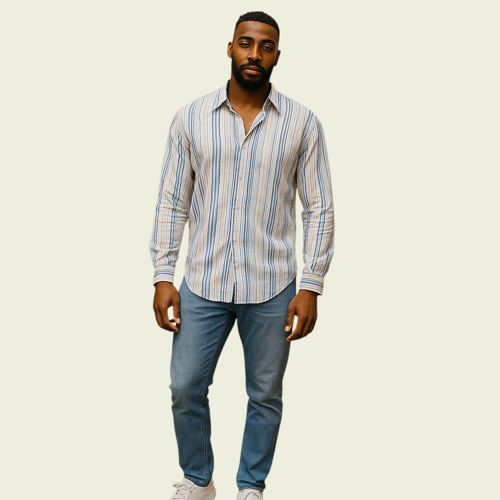 Man wearing a striped shirt and jeans on a beige background