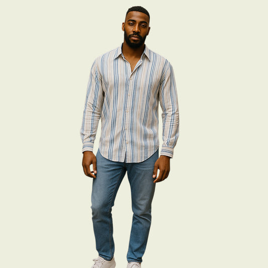 Man wearing a striped shirt and jeans on a beige background