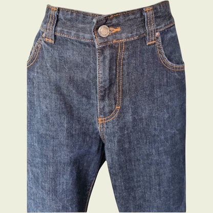 Pair of blue jeans on a beige background