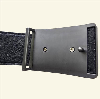 Black leather belt with a metal buckle on a light beige background