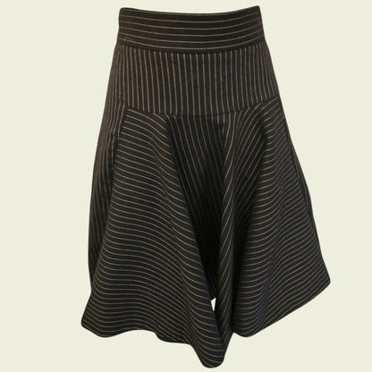 Black and white striped skirt on a beige background