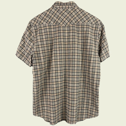 Plaid short-sleeve shirt on a beige background