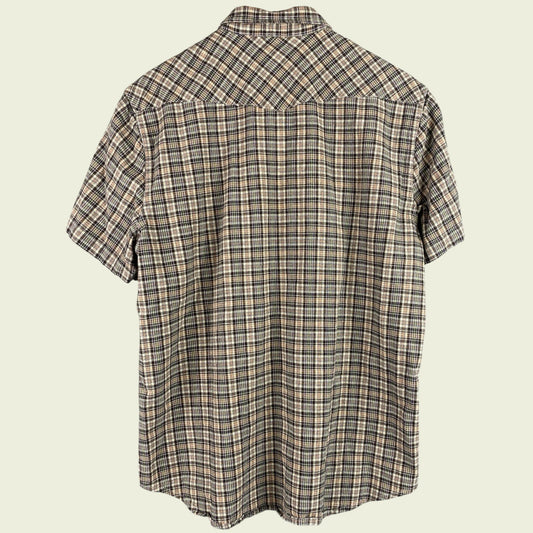 Plaid short-sleeve shirt on a beige background