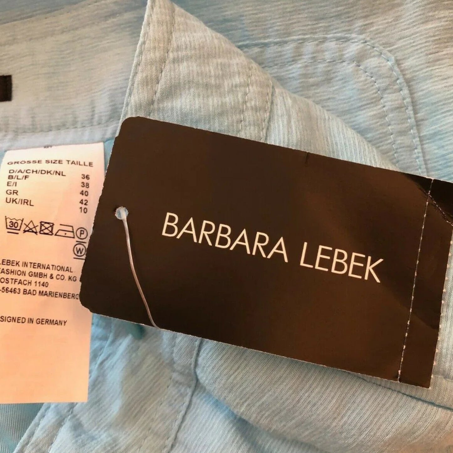 Barbara Lebek light blue summer pencil skirt, size UK 10, made from 82% Viscose and 18% Polyamide.
