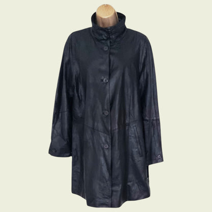 Black raincoat on a mannequin against a beige background