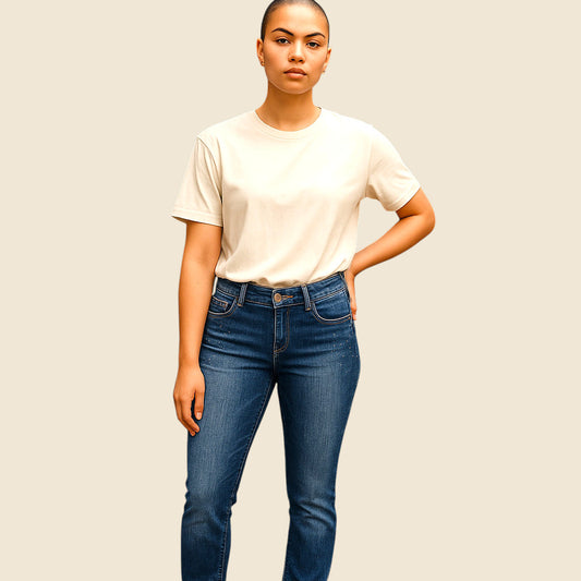 Person wearing a white t-shirt and blue jeans against a plain background