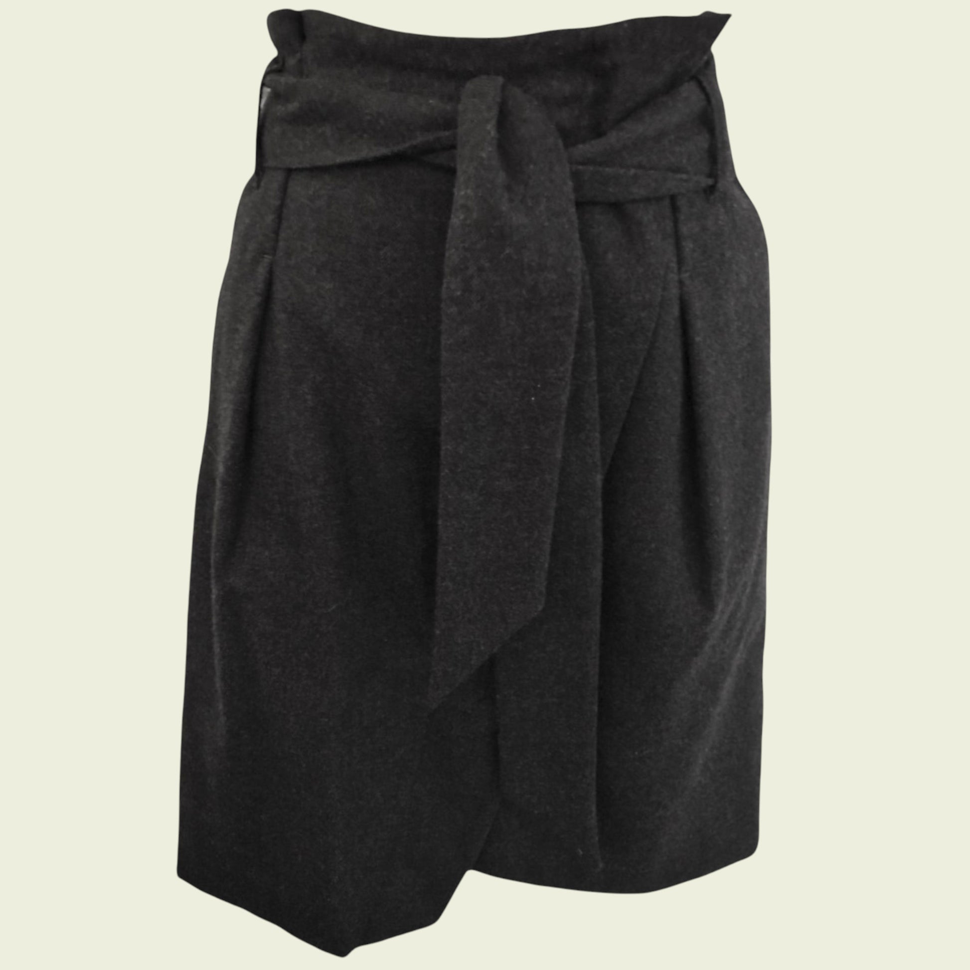 Dark gray skirt with a tie waist on a beige background