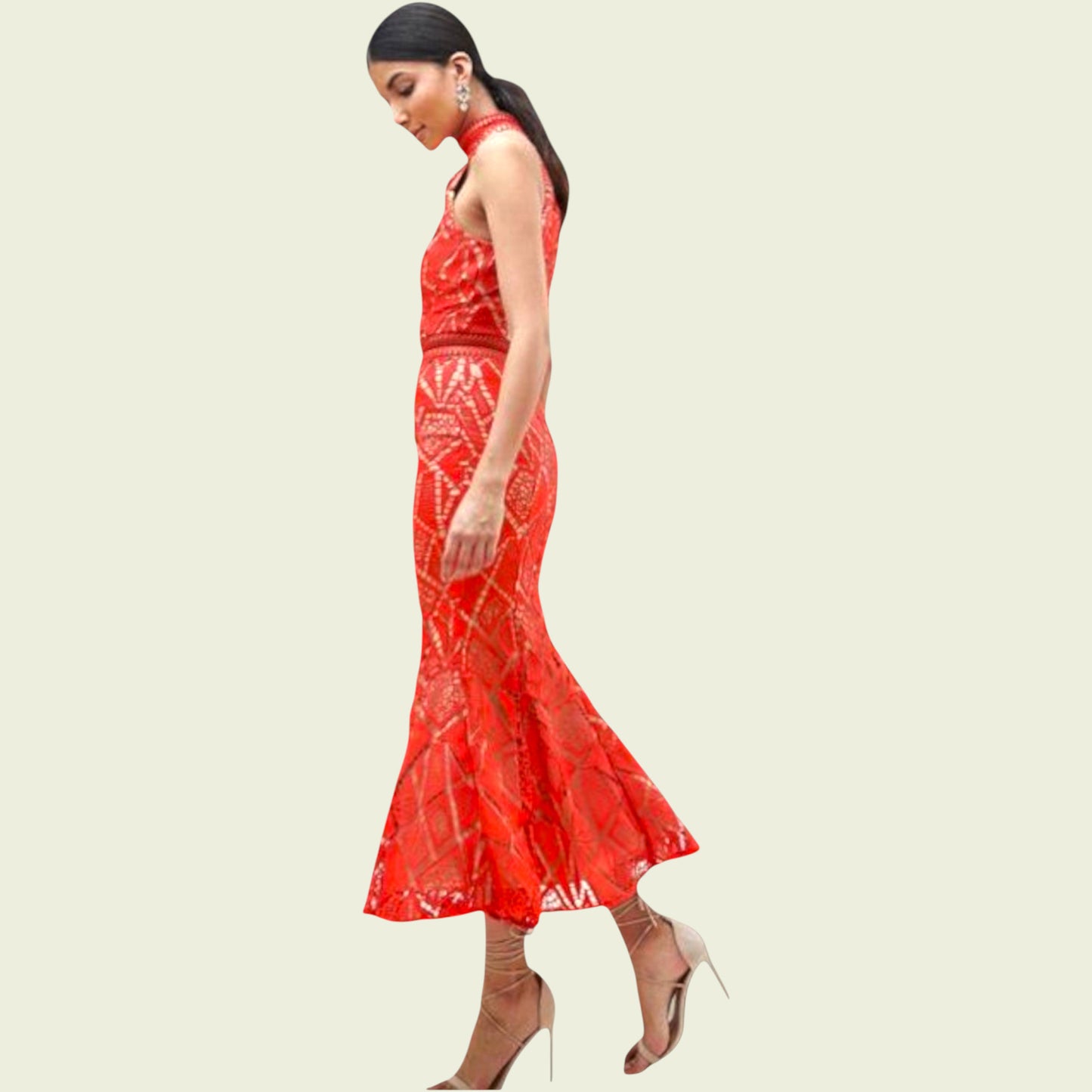 Woman wearing a red dress with a white pattern on a beige background