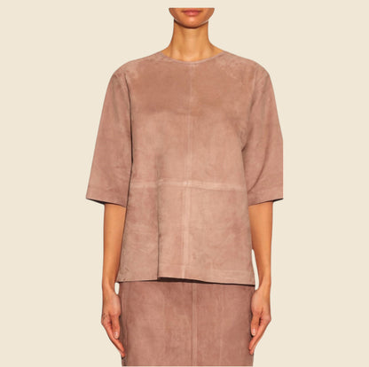 Brown suede top worn by a model on a beige background