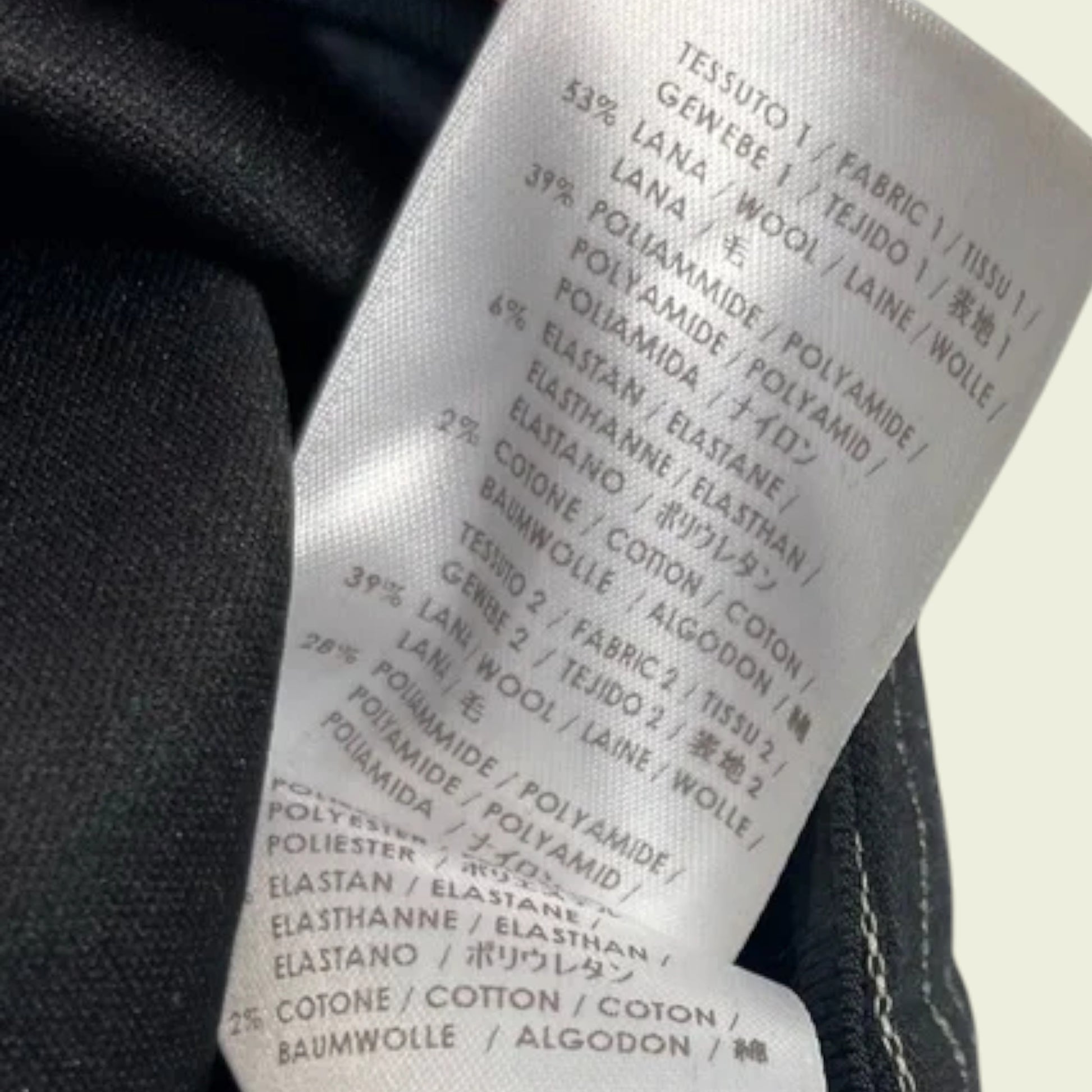 Clothing label with fabric composition details on a garment