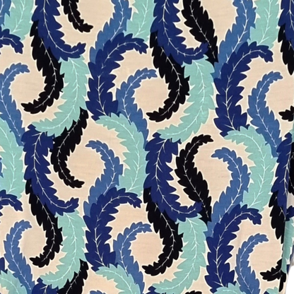 Pattern of blue, black, and green leaves on a beige background