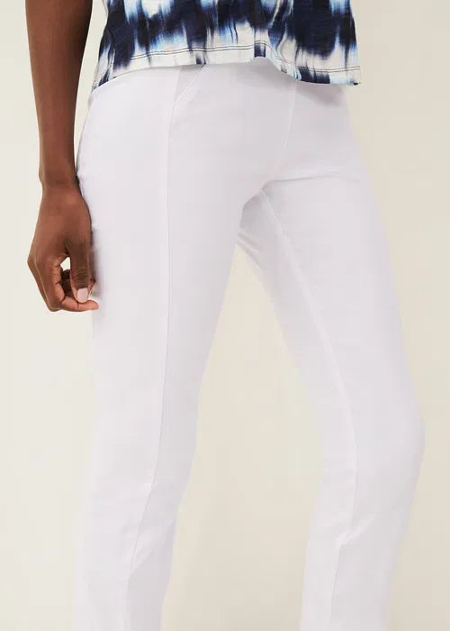 White pants worn by a person with a neutral background
