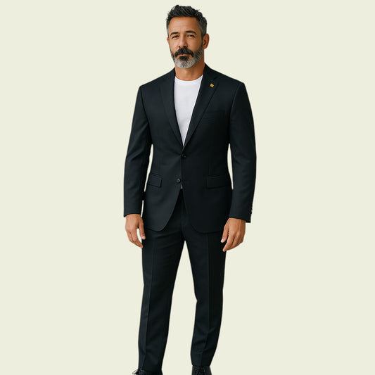 Man wearing a black jacket and white shirt on a beige background