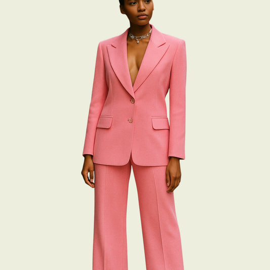 Person wearing a pink suit on a beige background