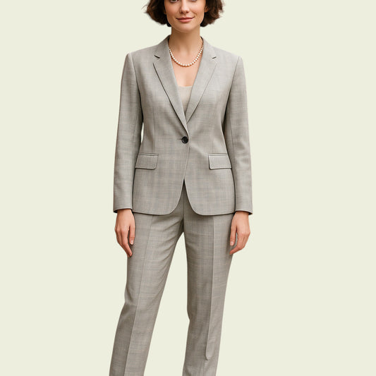 Woman wearing a mint green suit on a beige background