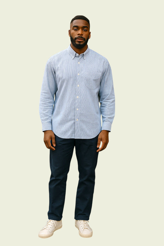 Man wearing blue striped shirt on beige background