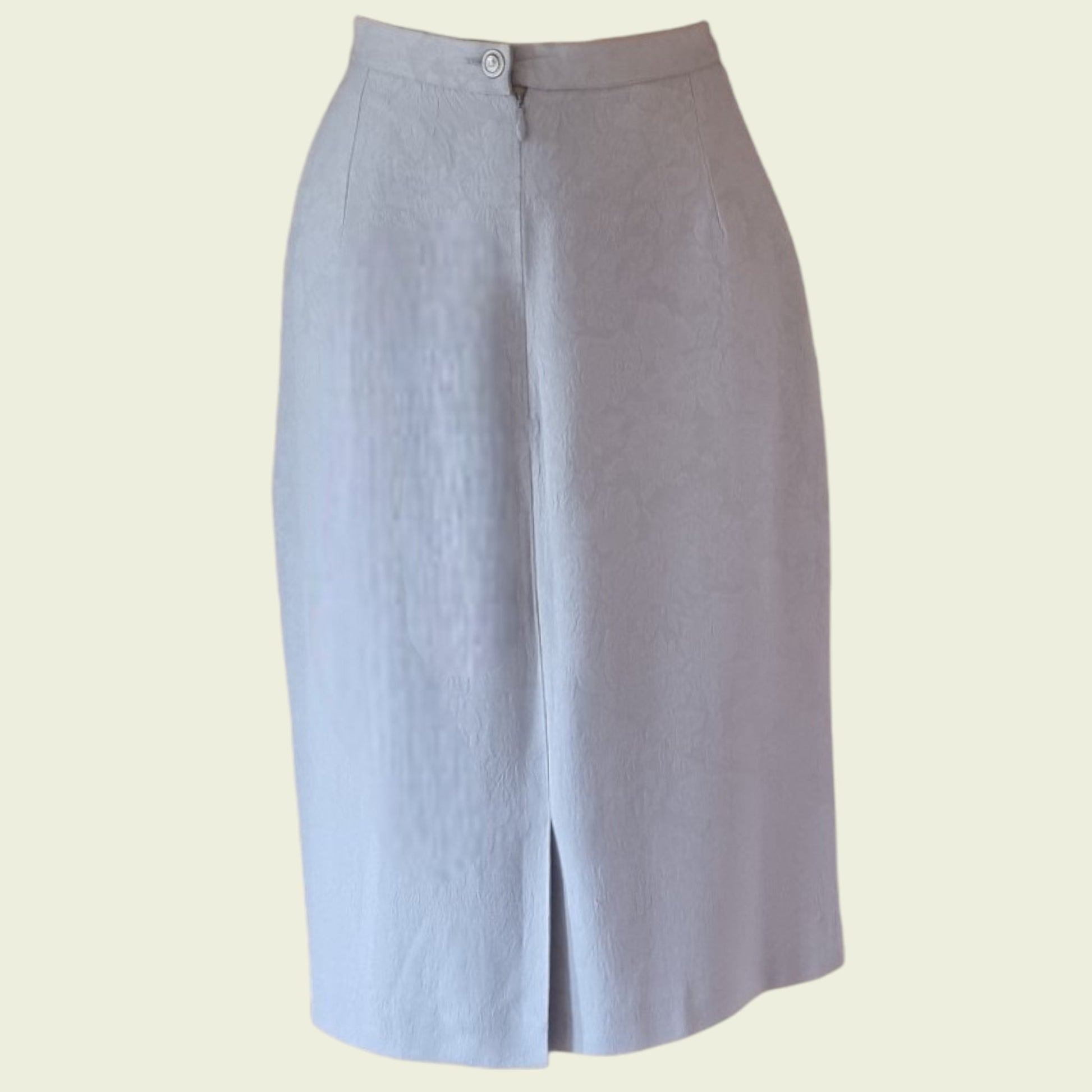 Light blue skirt with a slit on a beige background