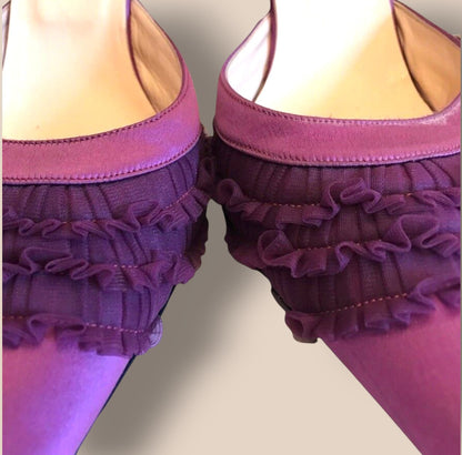 Purple ruffled underwear set on a neutral background
