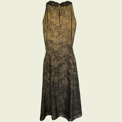 Black lace dress on a beige background