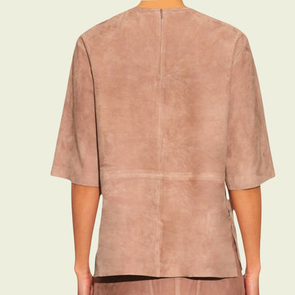 Tan suede top on a mannequin against a beige background