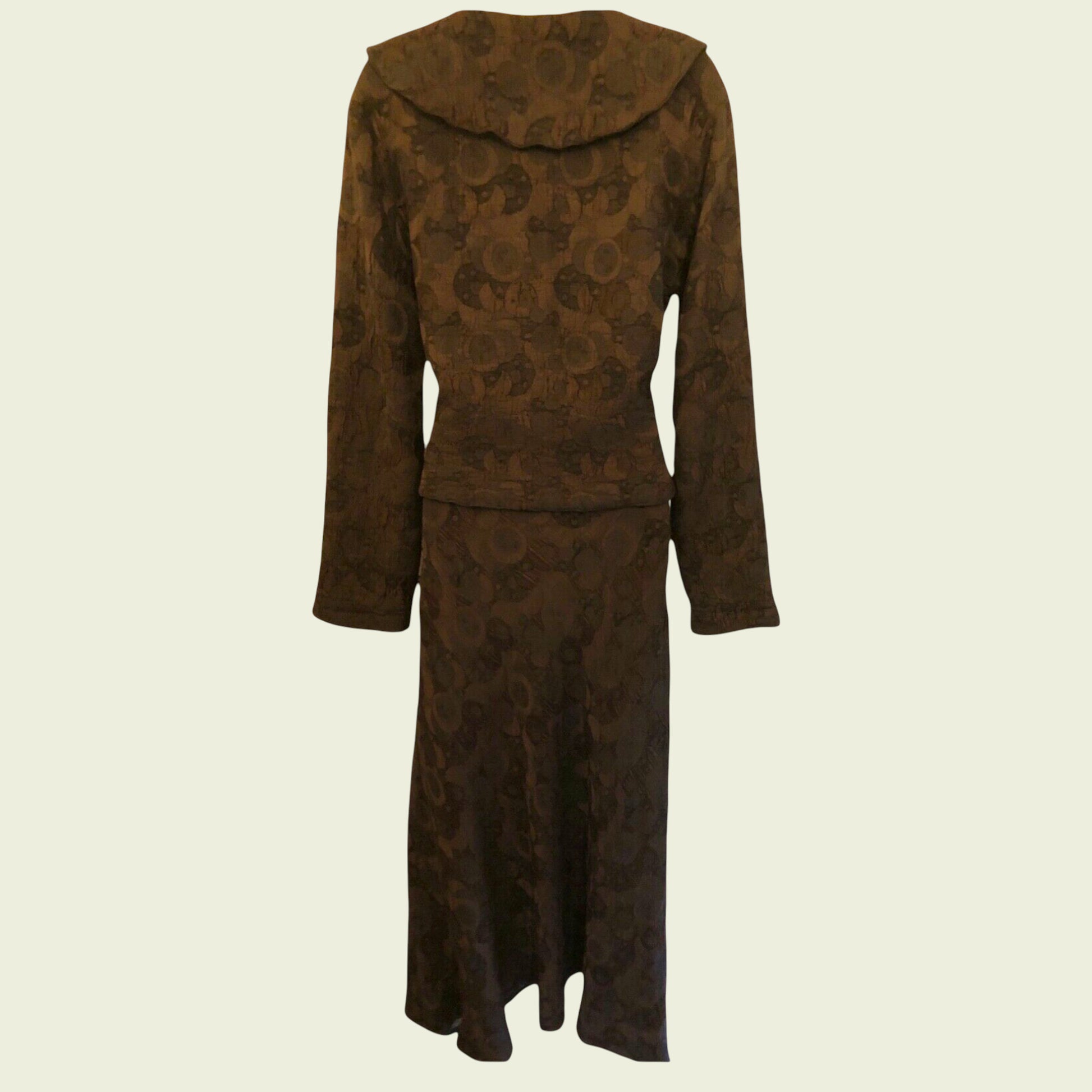 Brown patterned outfit skirt and jacket on a beige background