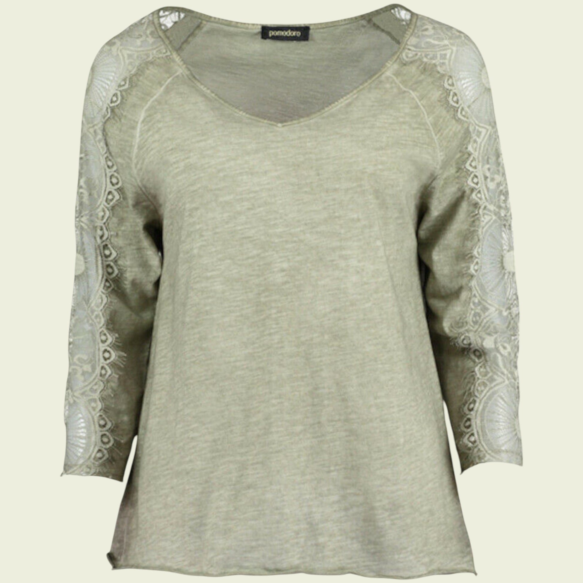 Light green long-sleeve top with lace detailing on a beige background