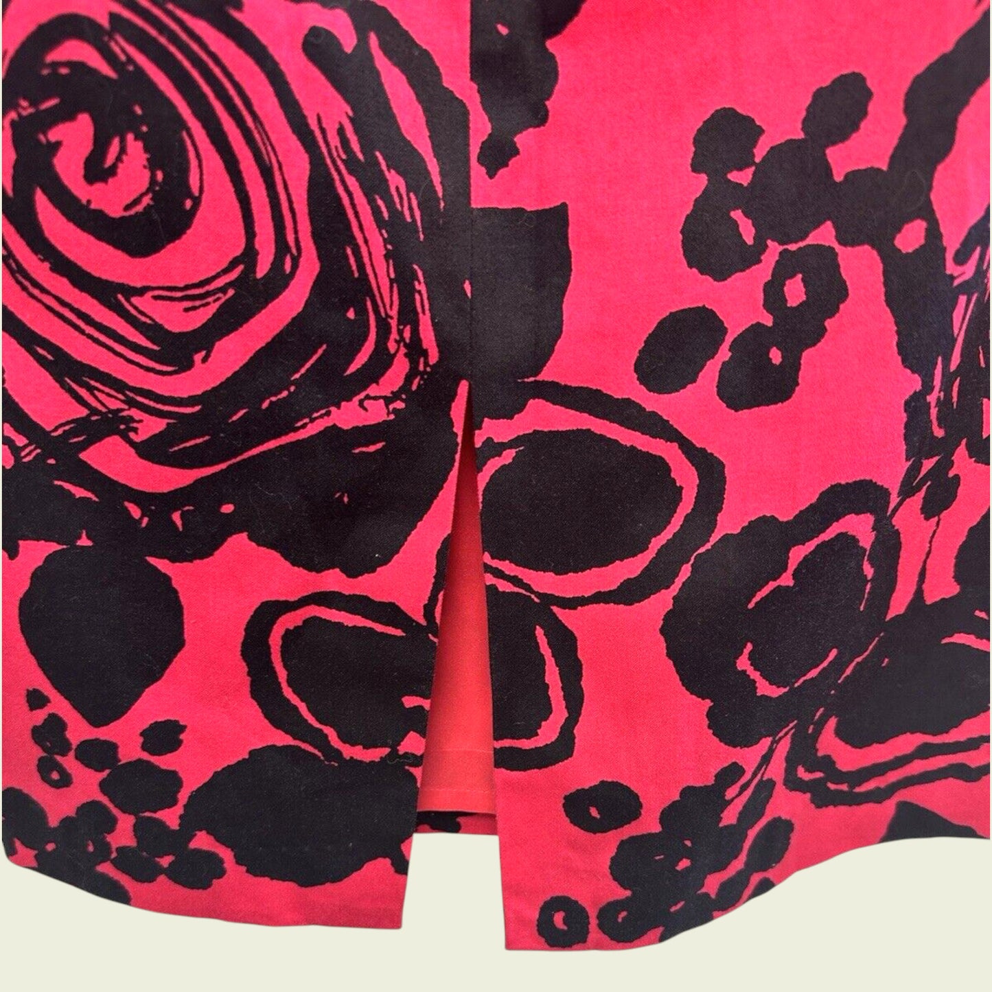 Pink fabric with black floral pattern