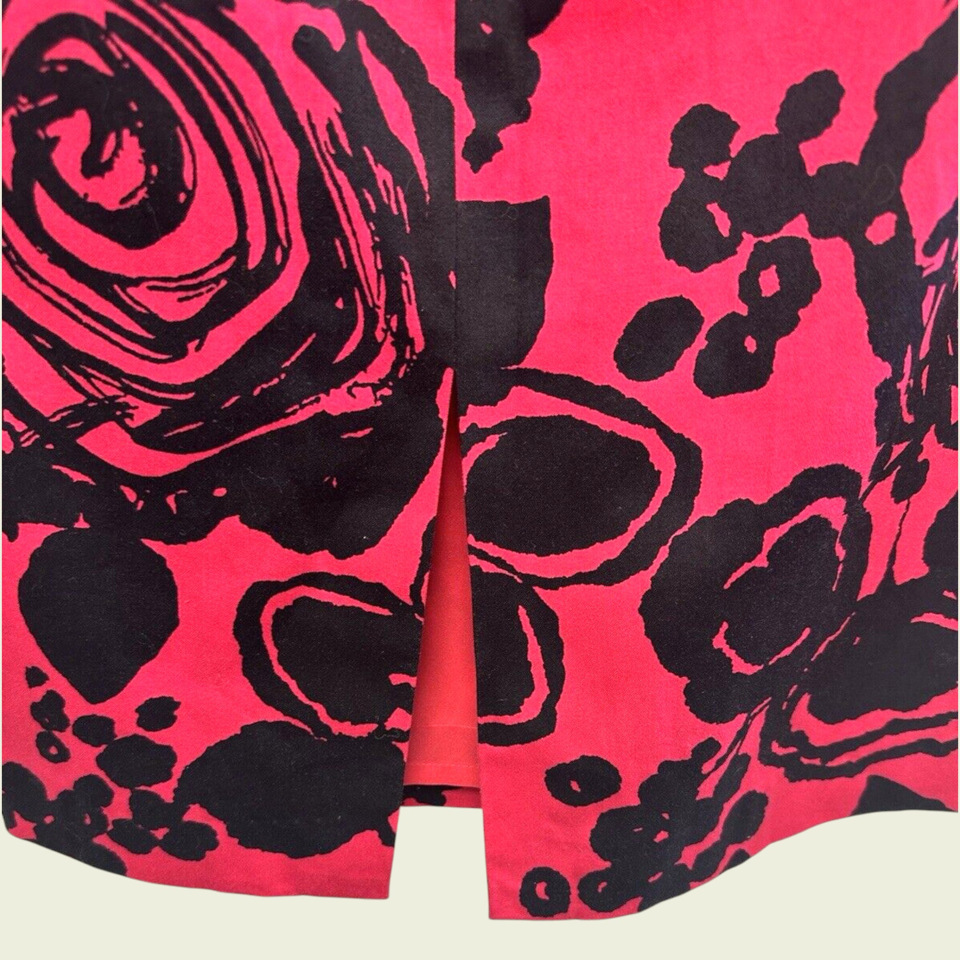 Pink fabric with black floral pattern