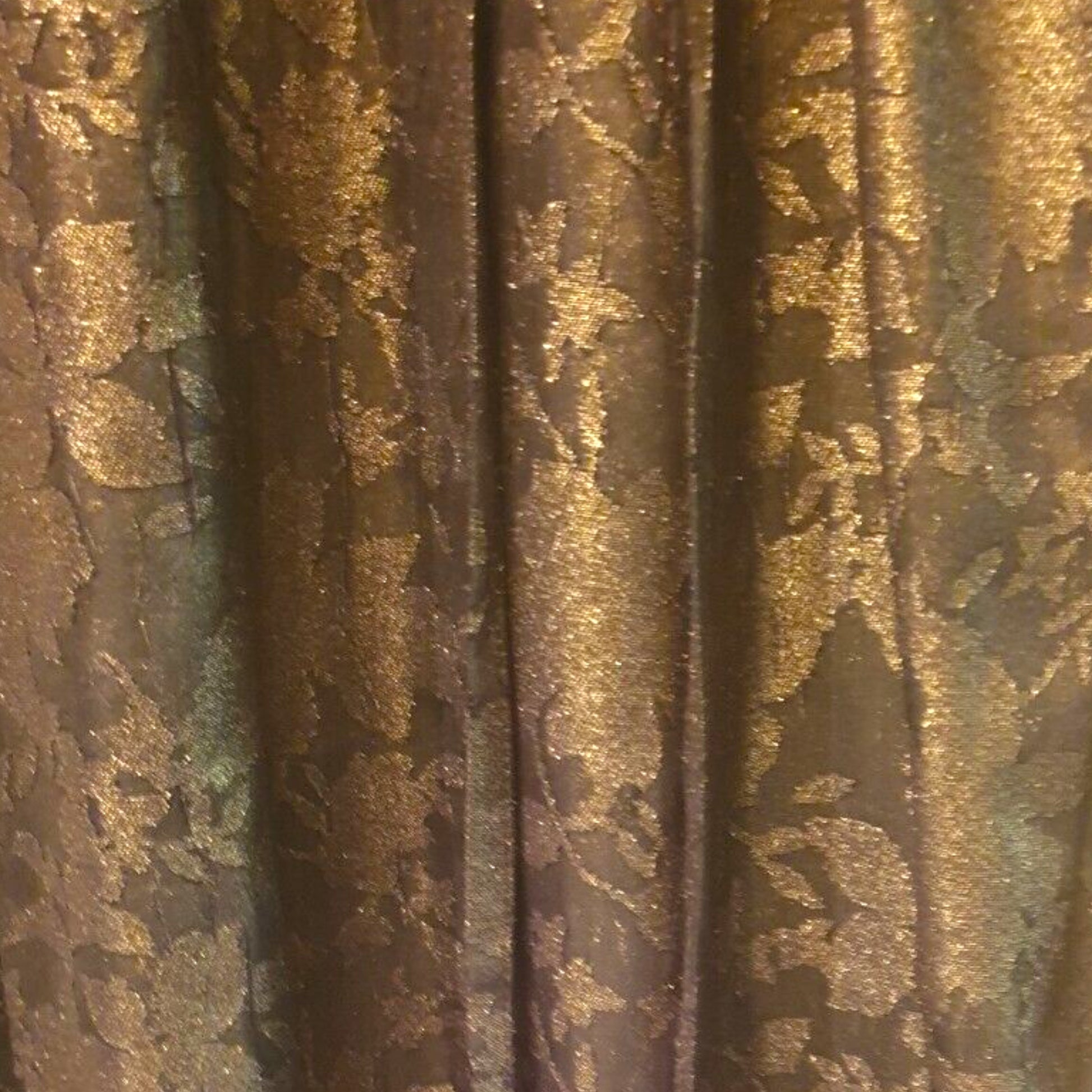 Close-up of textured fabric with gold and brown patterns