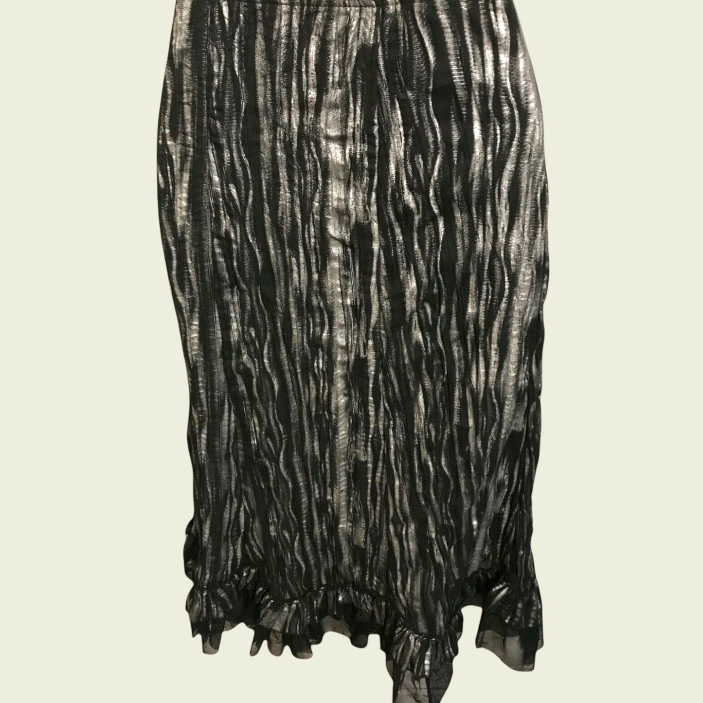 Black and white patterned skirt on a beige background