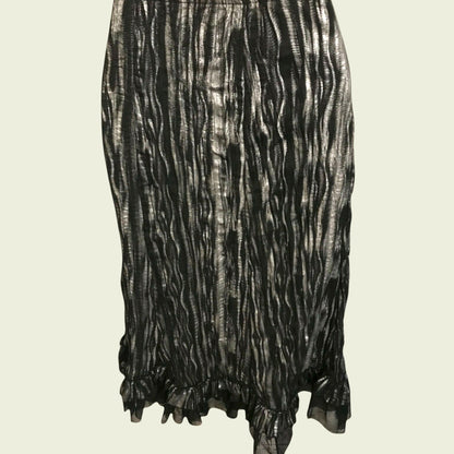 Black and white patterned skirt on a beige background