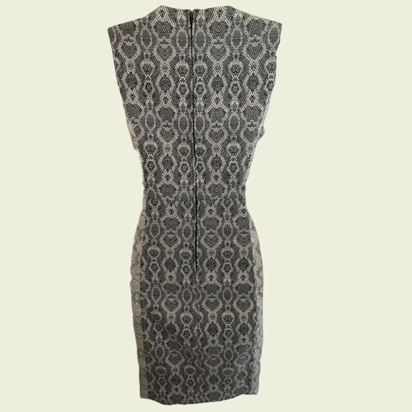 Black and white patterned dress on a beige background