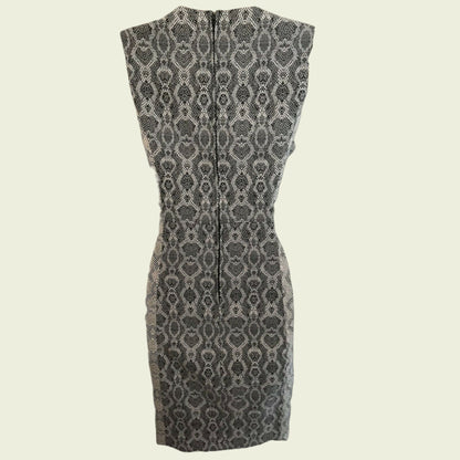 Black and white patterned dress on a beige background