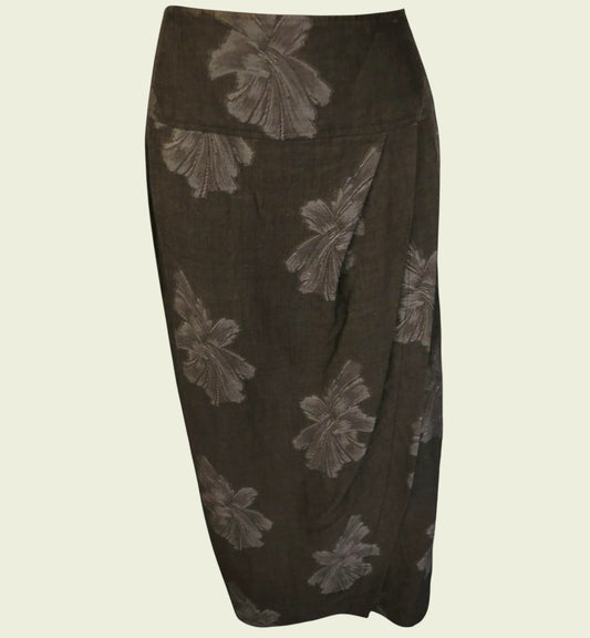 Dark brown skirt with floral patterns on a beige background