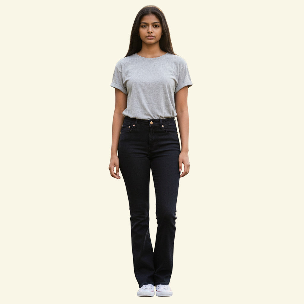 Timelessfashions black bootcut jeans with contoured mid-rise waist and classic bootcut leg. Made from cotton blend.