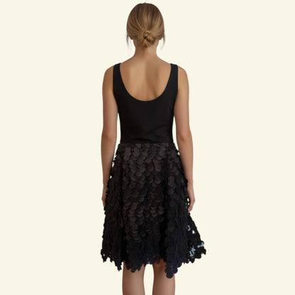 Timelessfashions black fit & flare dress with disc detail, square neckline, and grosgrain textured fabric. Size UK 12.