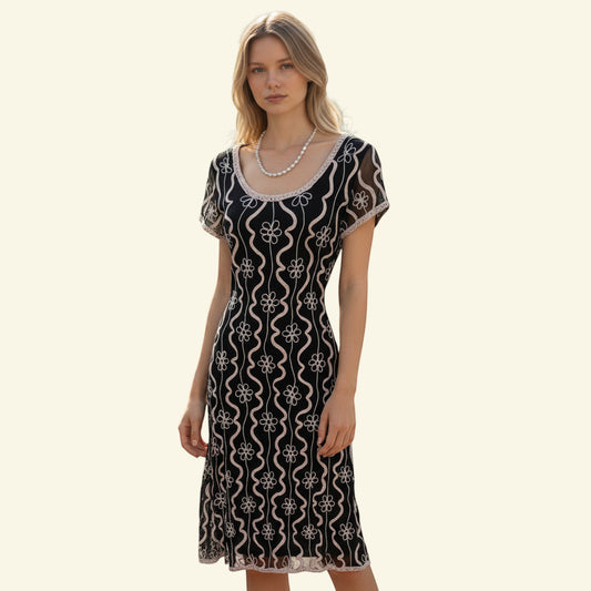 Timelessfashions black midi dress with cream tapework floral detailing and cap sleeves. Pull on style.