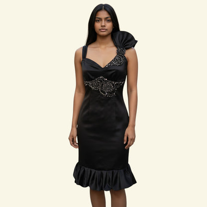 Karen Millen black satin bodycon dress with diamanté embellishment on the bodice and a bow detail on the shoulder. Frilled hem.