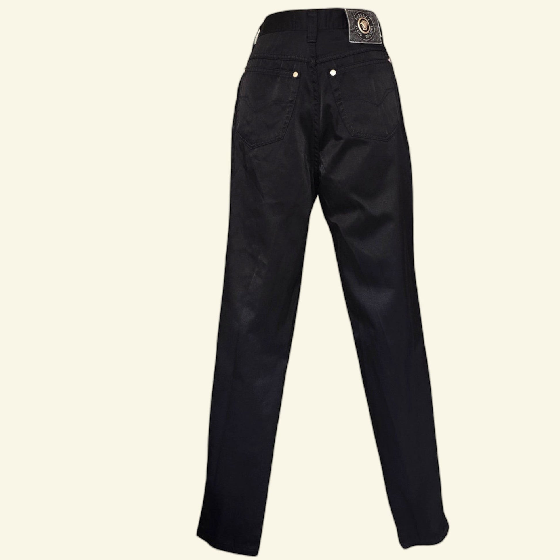 Timelessfashions Versace black cotton skinny jeans with gold button details and a leather logo patch.