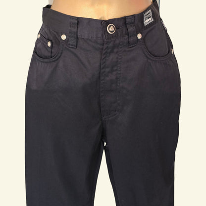 Timelessfashions Versace womens black skinny cotton jeans with silver button details and iconic Medusa head emblem.