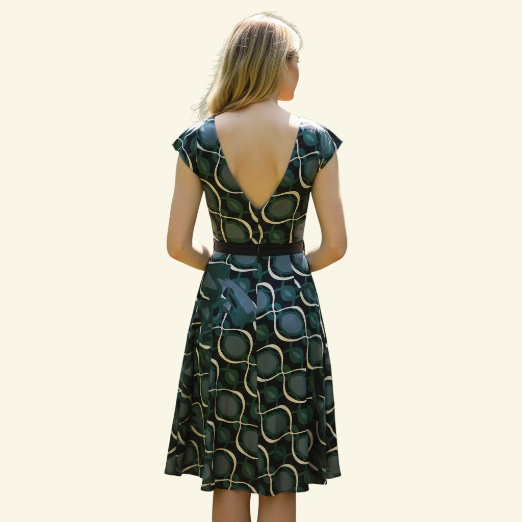 Timelessfashions green, navy, and cream patterned silk midi dress with V-neck and tie belt.
