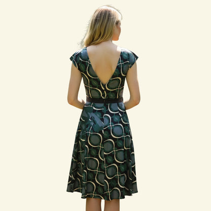 Timelessfashions green, navy, and cream patterned silk midi dress with V-neck and tie belt.