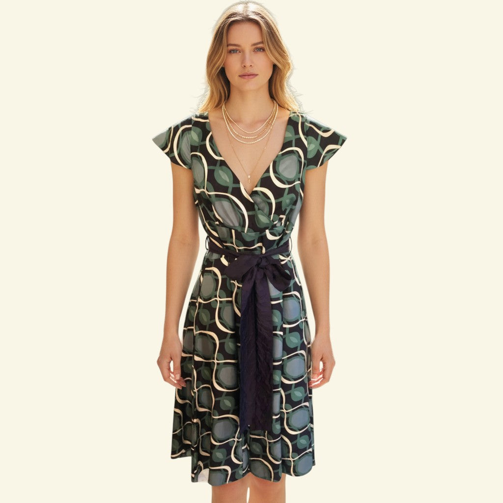 Timelessfashions green, navy, and white patterned silk midi dress with V-neck, tie belt, and cap sleeves.