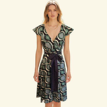 Timelessfashions green, navy, and white patterned silk midi dress with V-neck, tie belt, and cap sleeves.